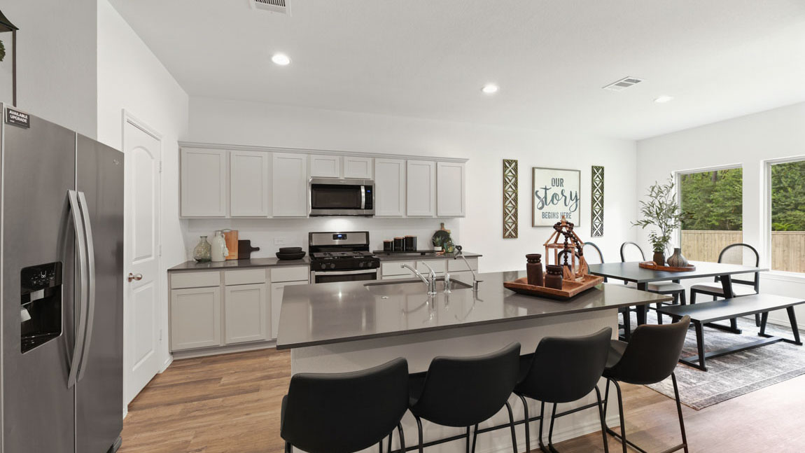 Kitchen with an island and vinyl floor
