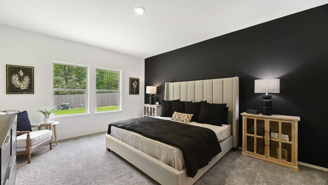 Primary bedroom with carpet flooring