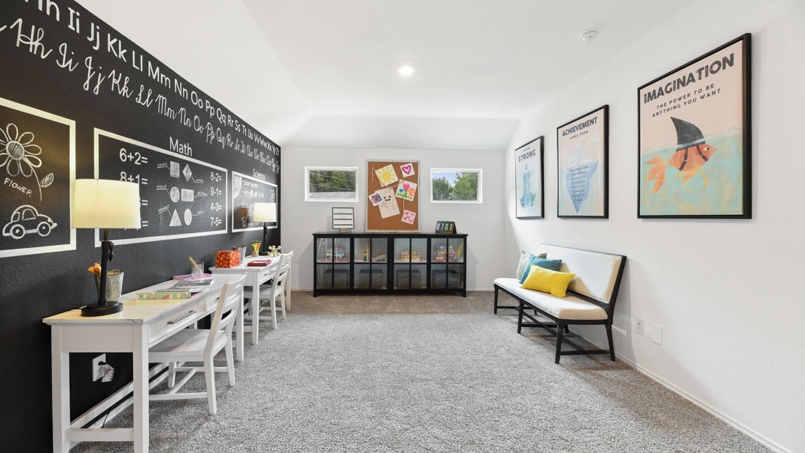 Second story game room with carpet flooring