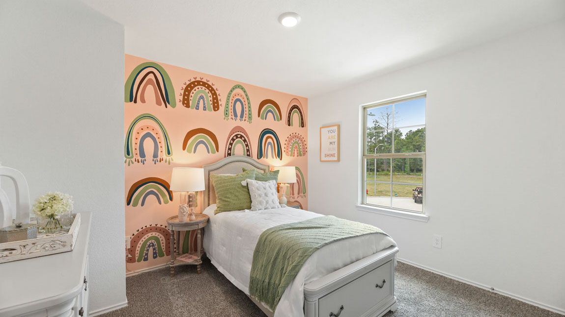 Secondary bedroom with carpet flooring