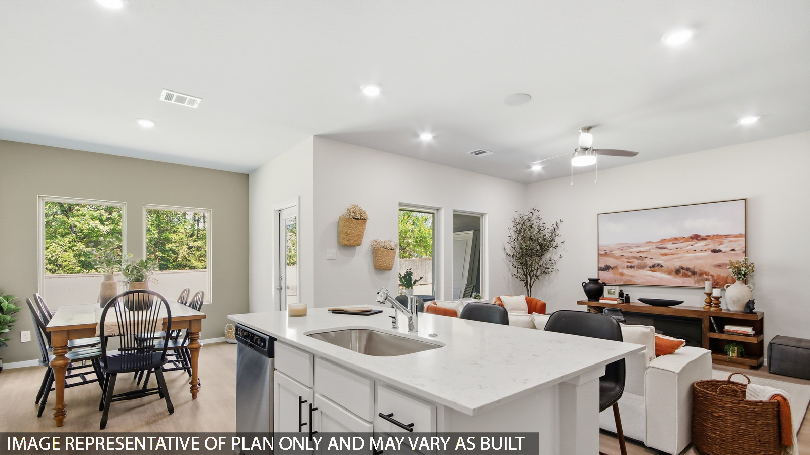 Kitchen with quartz countertops and marden hardware and an island and vinyl floor