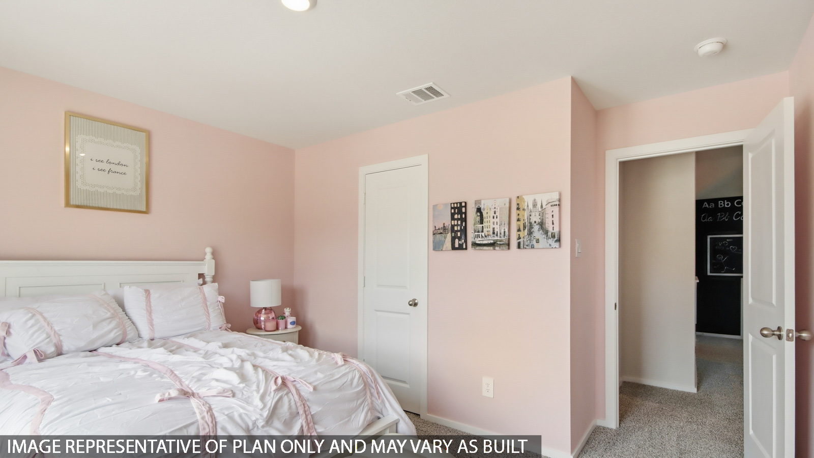 Second level secondary bedroom with carpet flooring and bright window