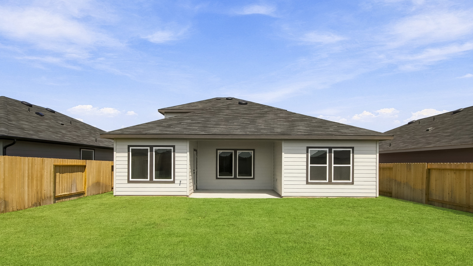 covered patio with jamies hardie siding and overhead lighting