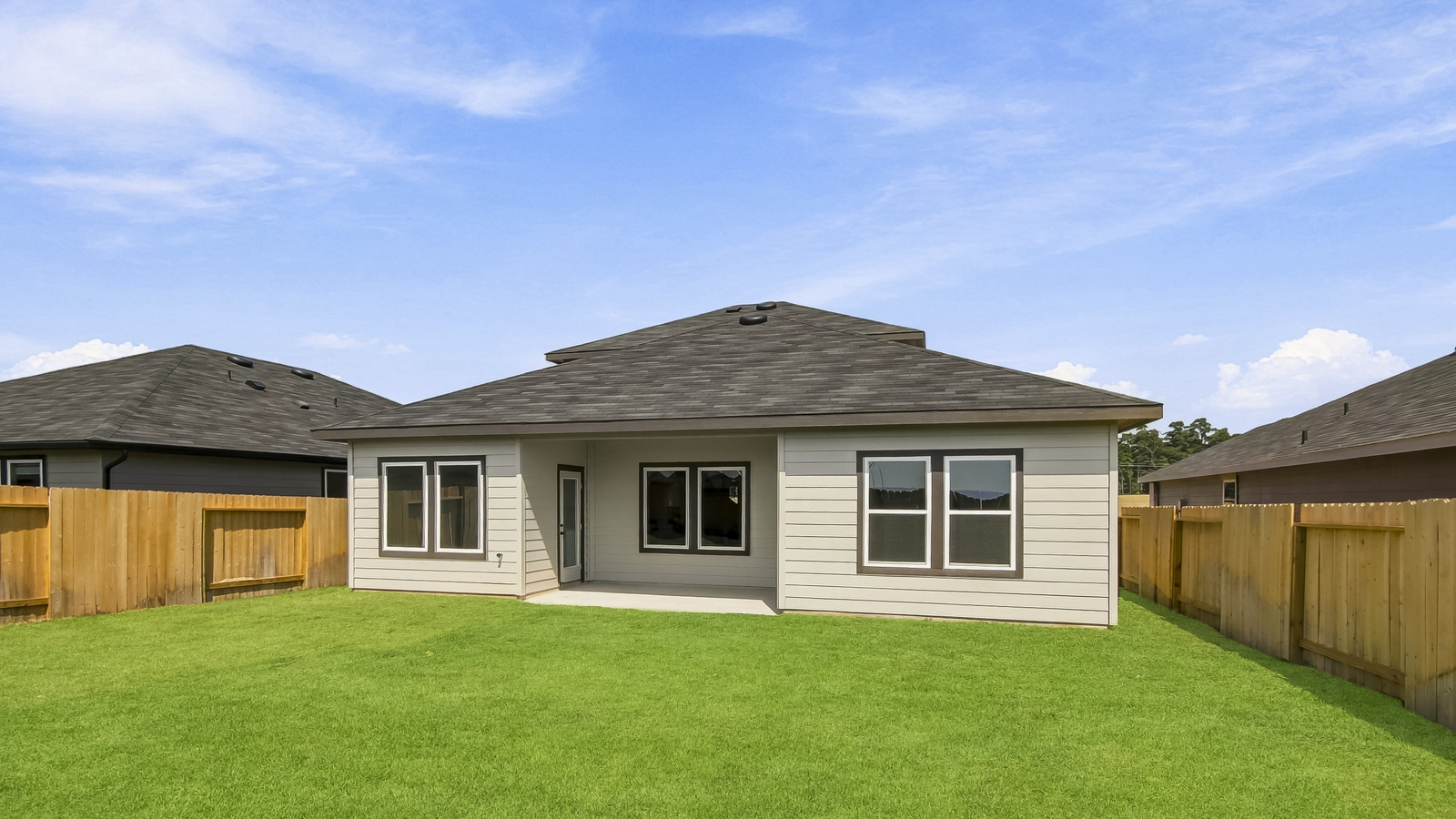 covered patio with jamies hardie siding and overhead lighting