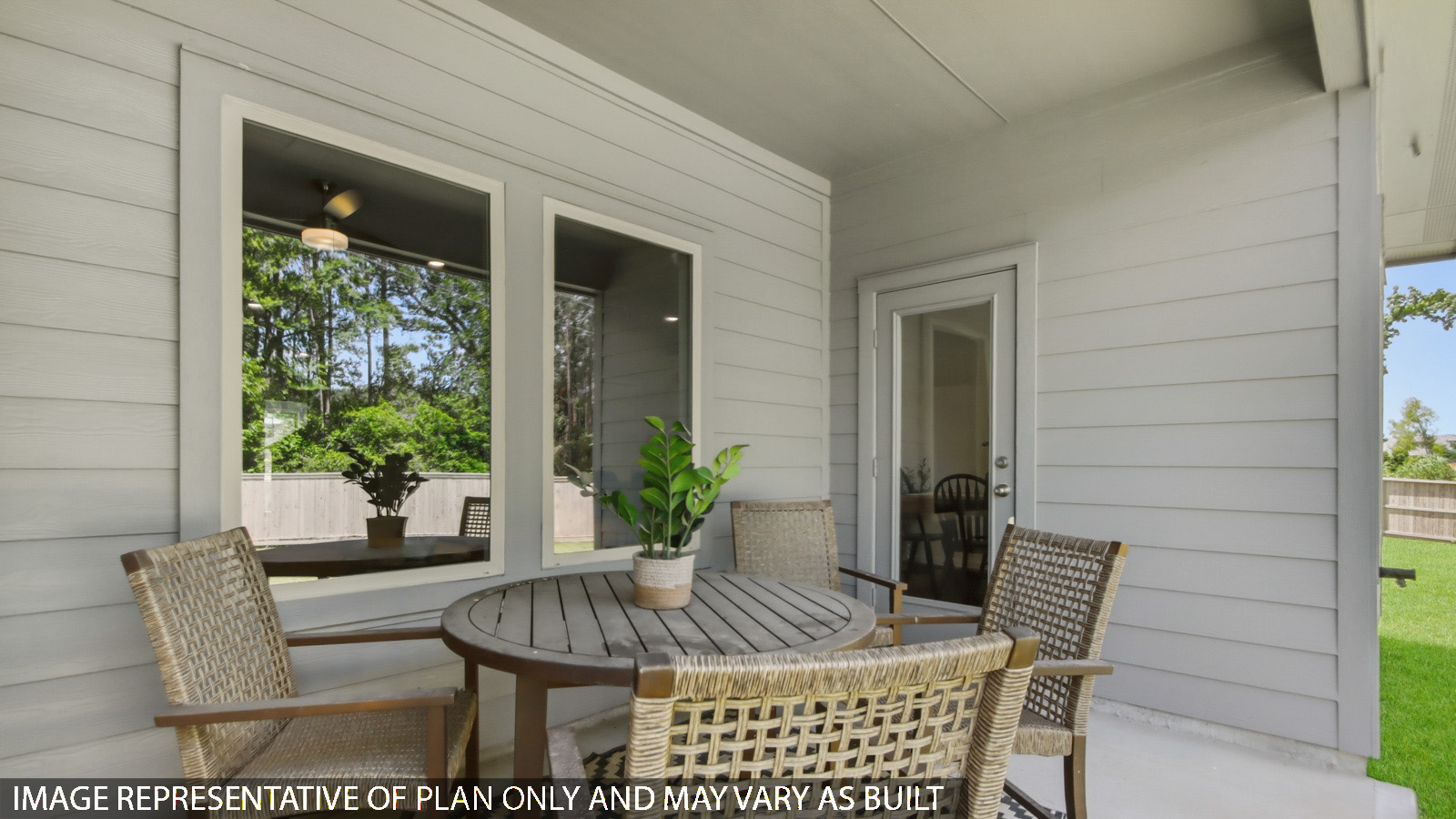 covered patio with jamies hardie siding and overhead lighting