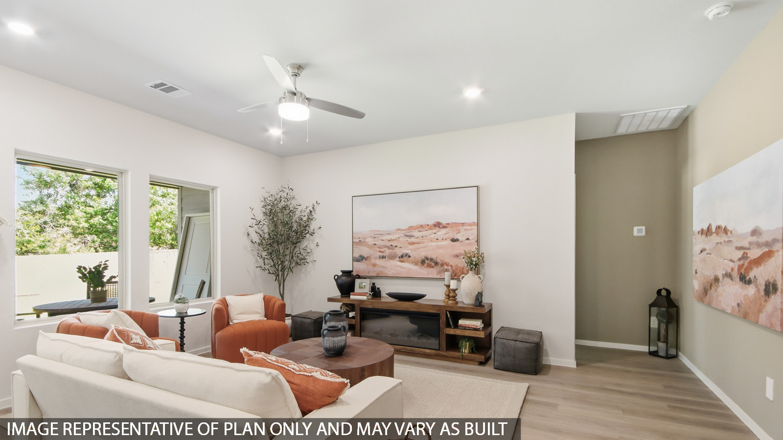 Spacious living area with vinyl flooring and bright windows in Magnolia TX