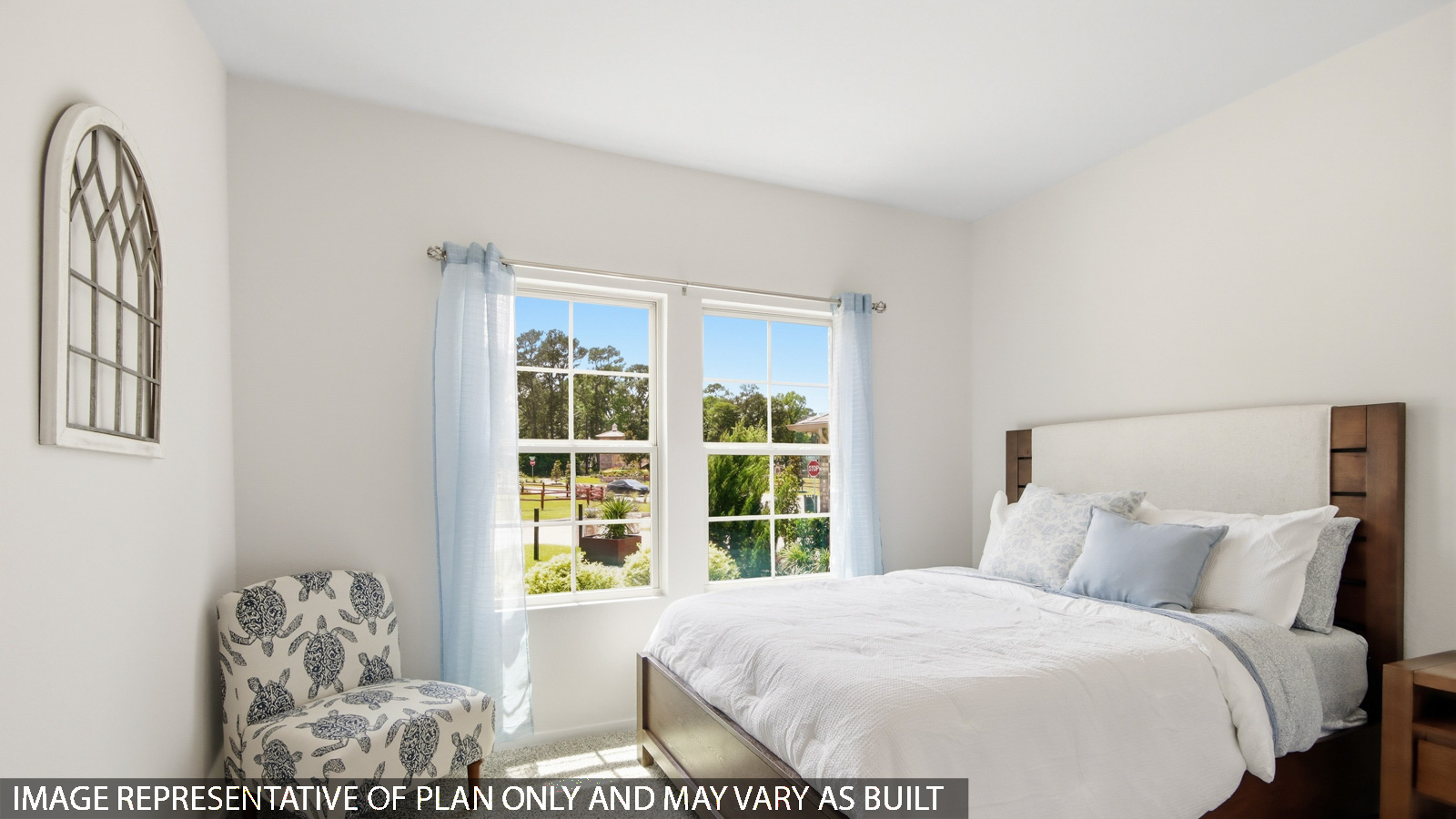 Secondary bedroom with shag carpet flooring and bright window
