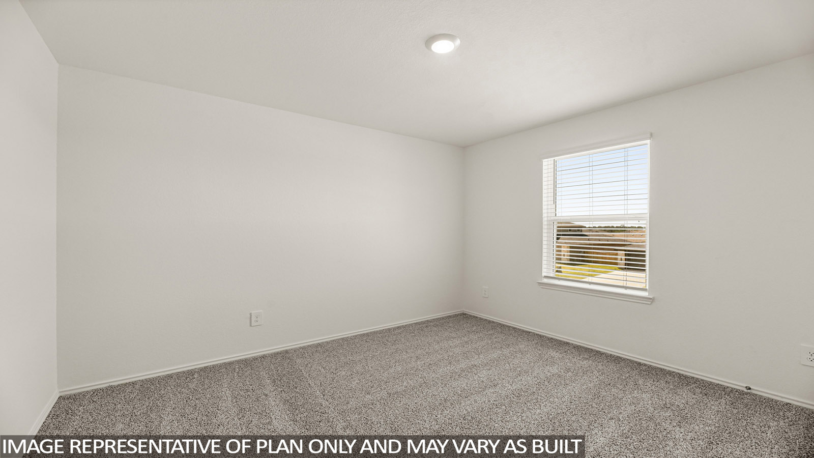 Secondary bedroom with windows, white walls, and light carpet.