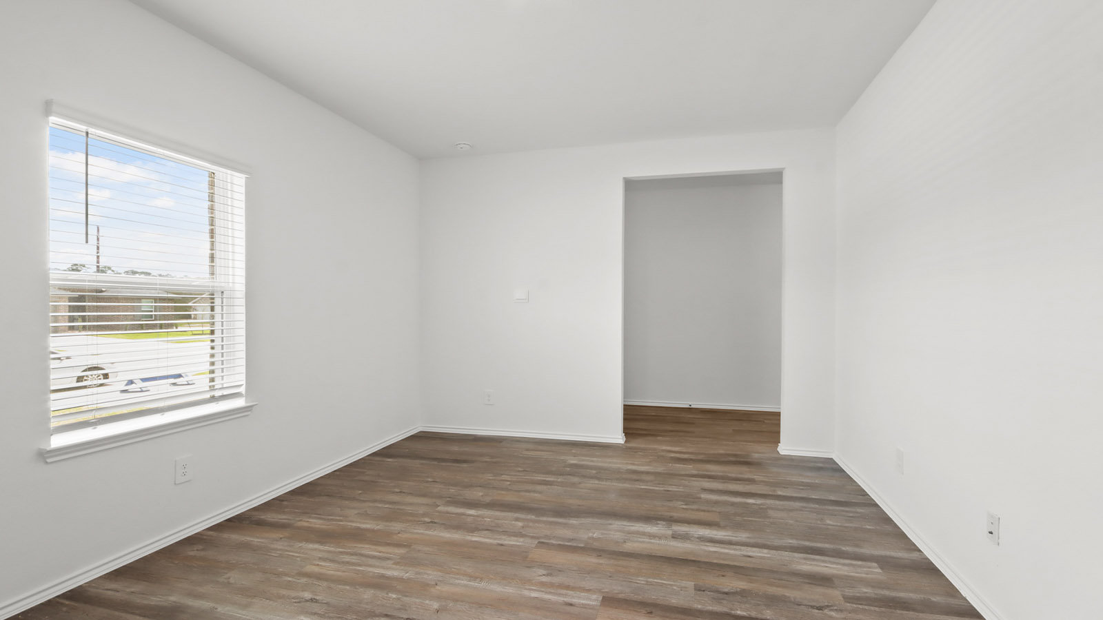 Dining area with vinyl flooring located off from the living room area in Magnolia TX