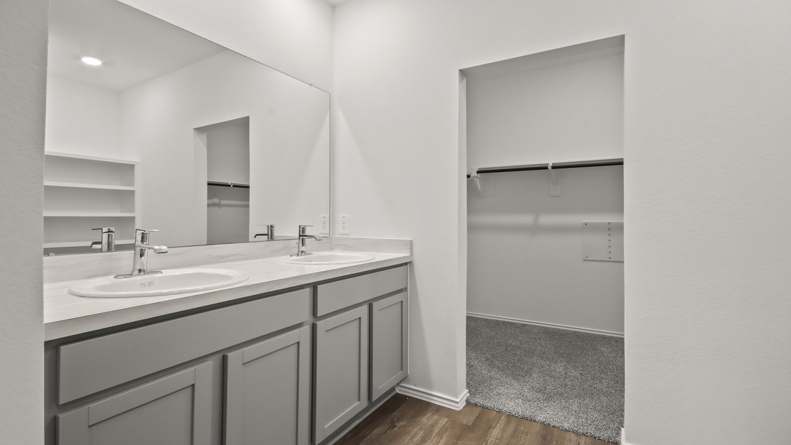 Primary bathroom with stand-alone shower with tiles and semi frameless glass in Magnolia TX