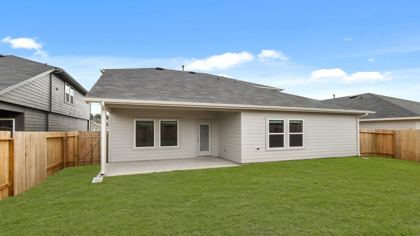 covered patio with jamies hardie siding and overhead lighting