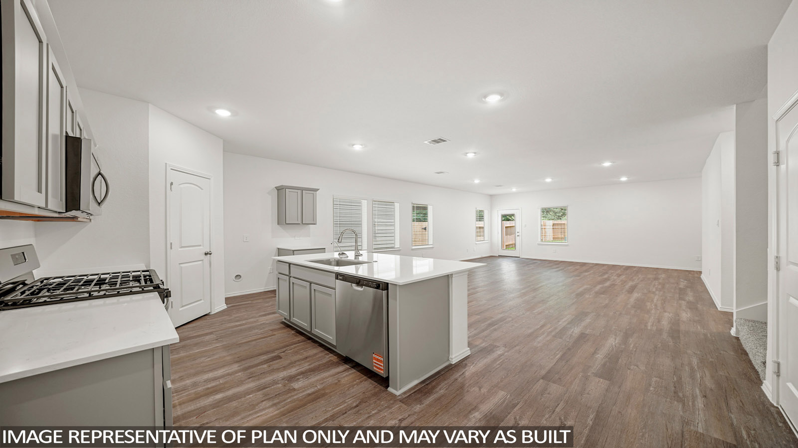 Kitchen with an island and vinyl floor