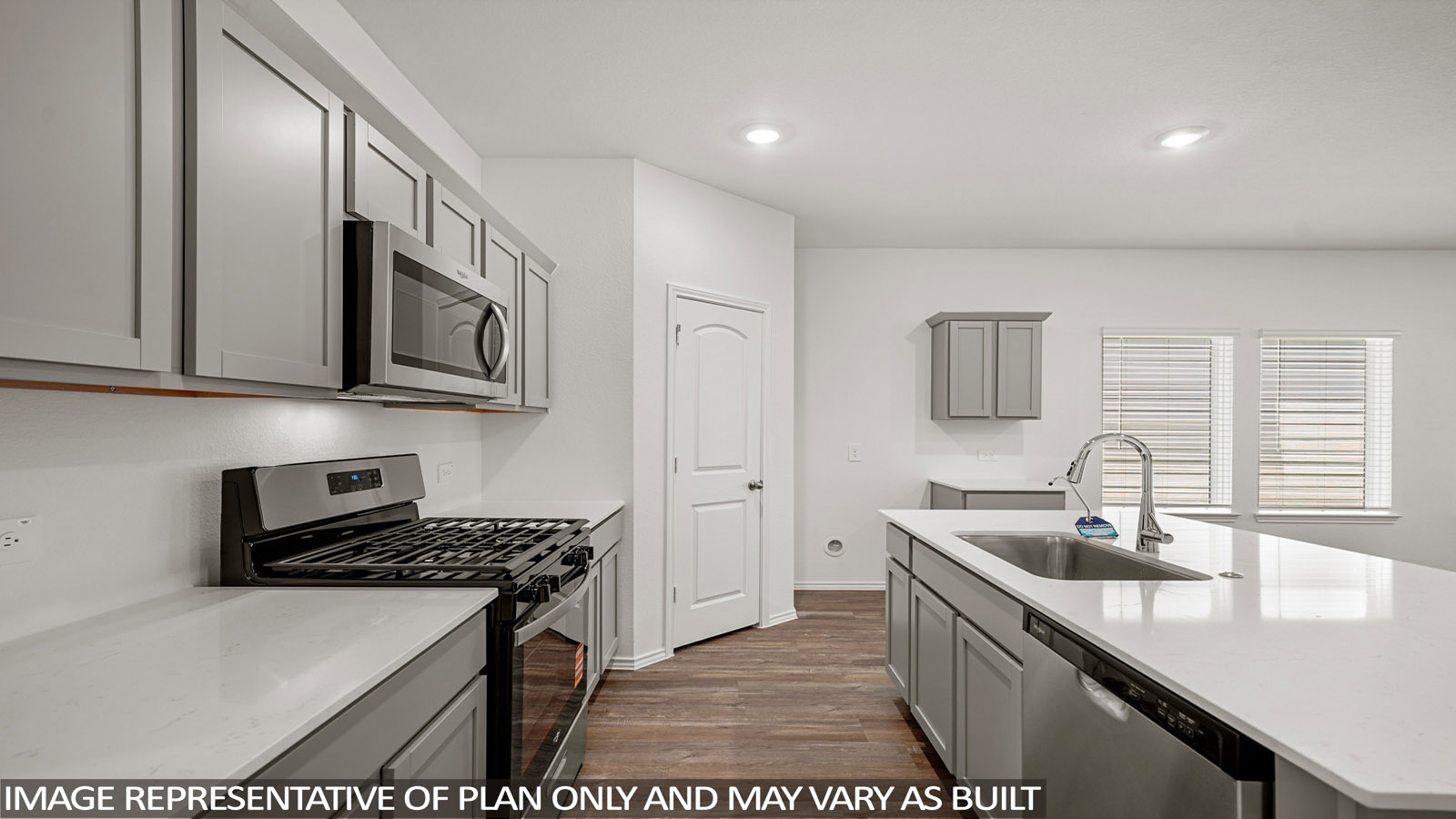 Kitchen with an island and vinyl floor