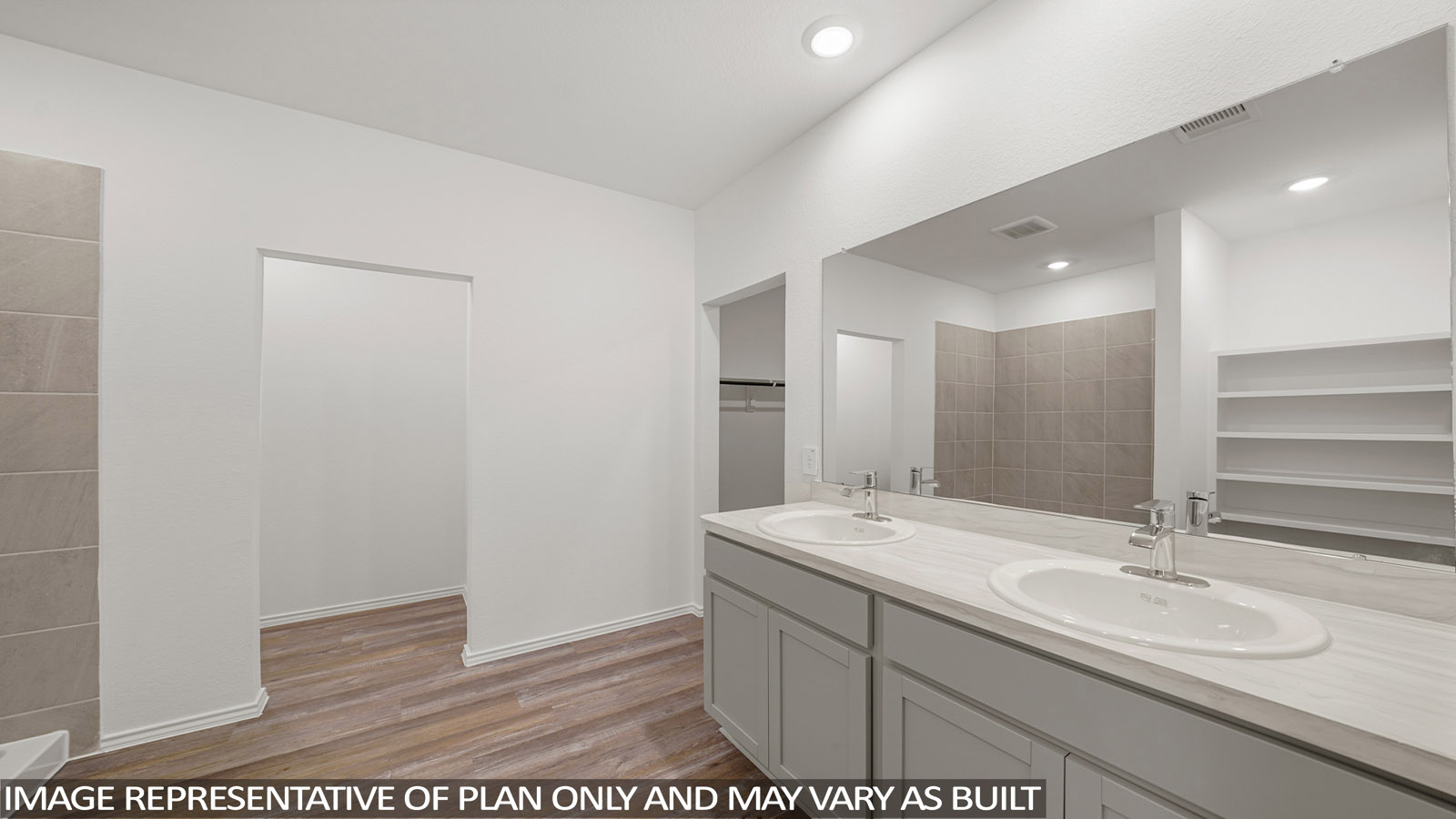 Primary bathroom with double sinks with quartz counter tops in Magnolia TX
