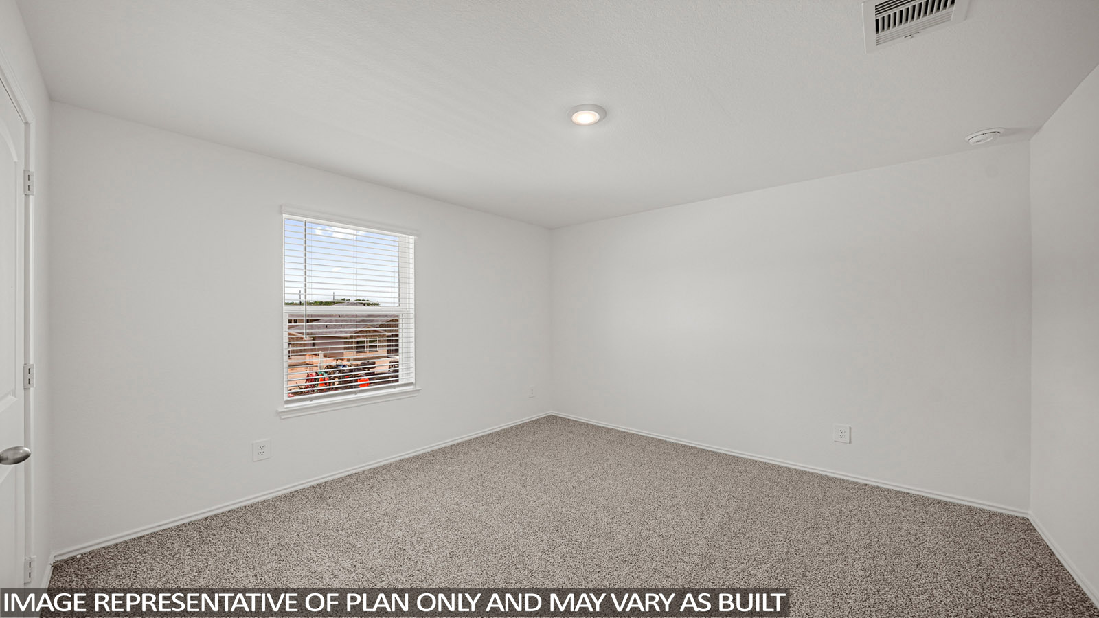 Secondary bedroom with shag carpet flooring and bright window
