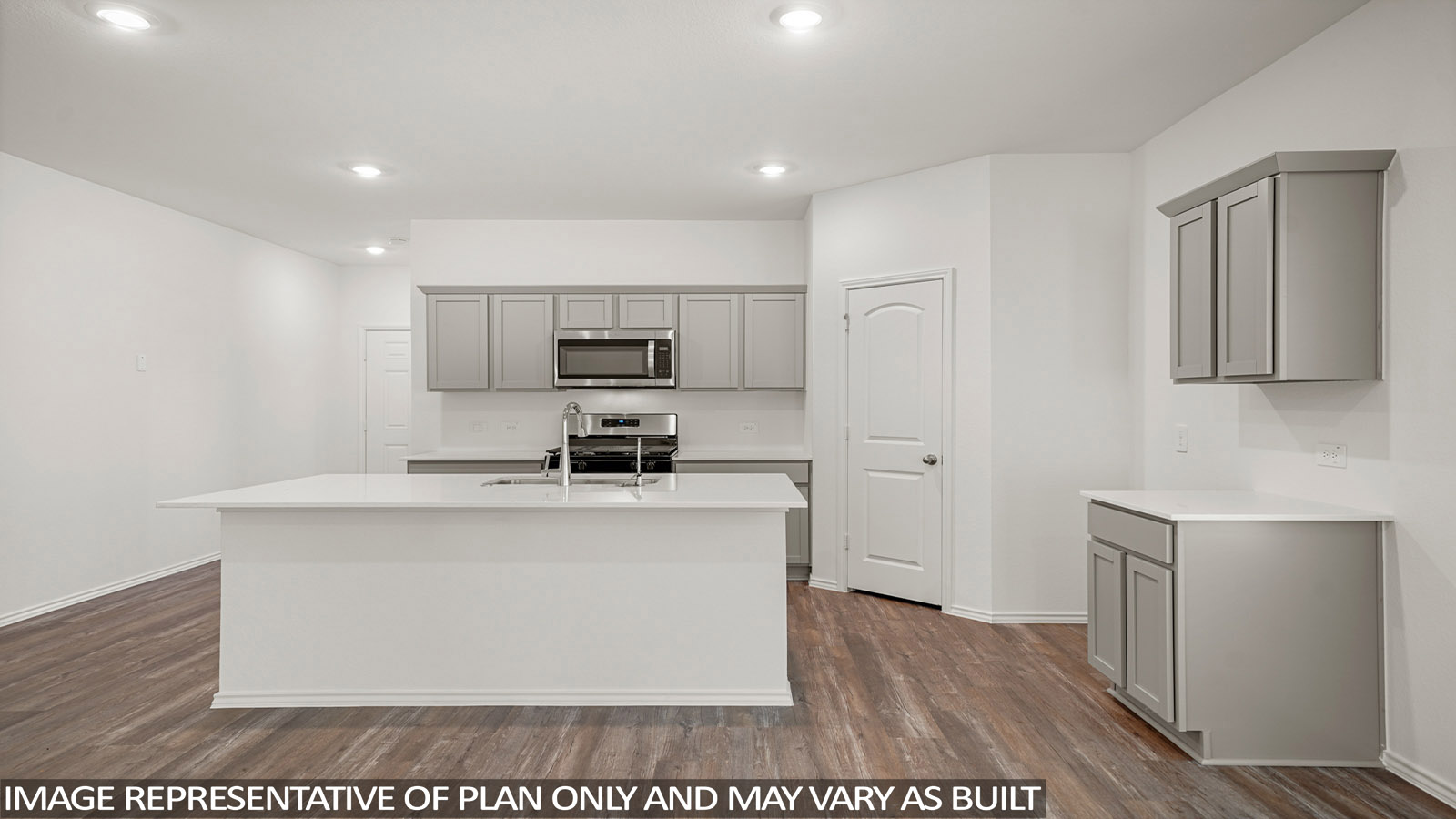 Kitchen with quartz countertops and marden hardware and an island and vinyl floor