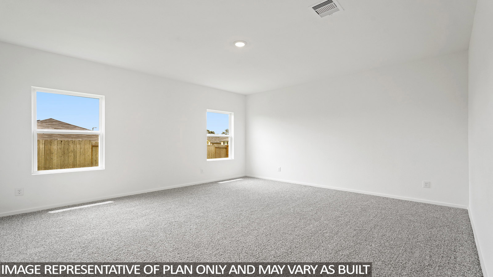 Large Primary bedroom with shag carpet flooring and bright window