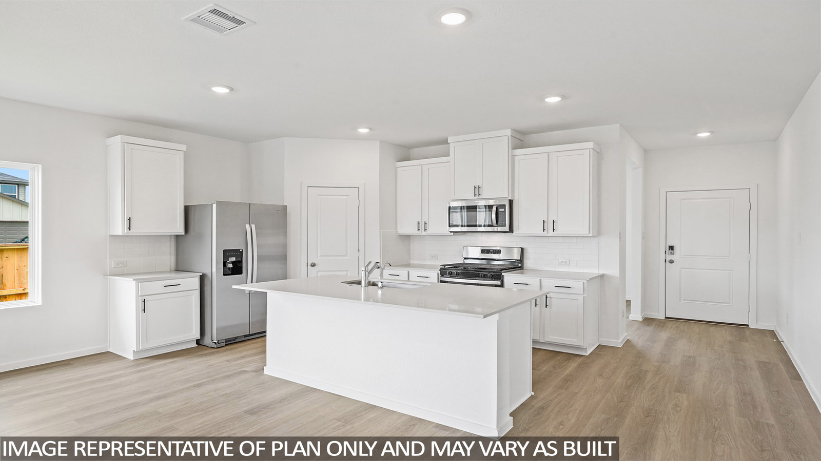 Kitchen with quartz countertops and marden hardware and an island and vinyl floor