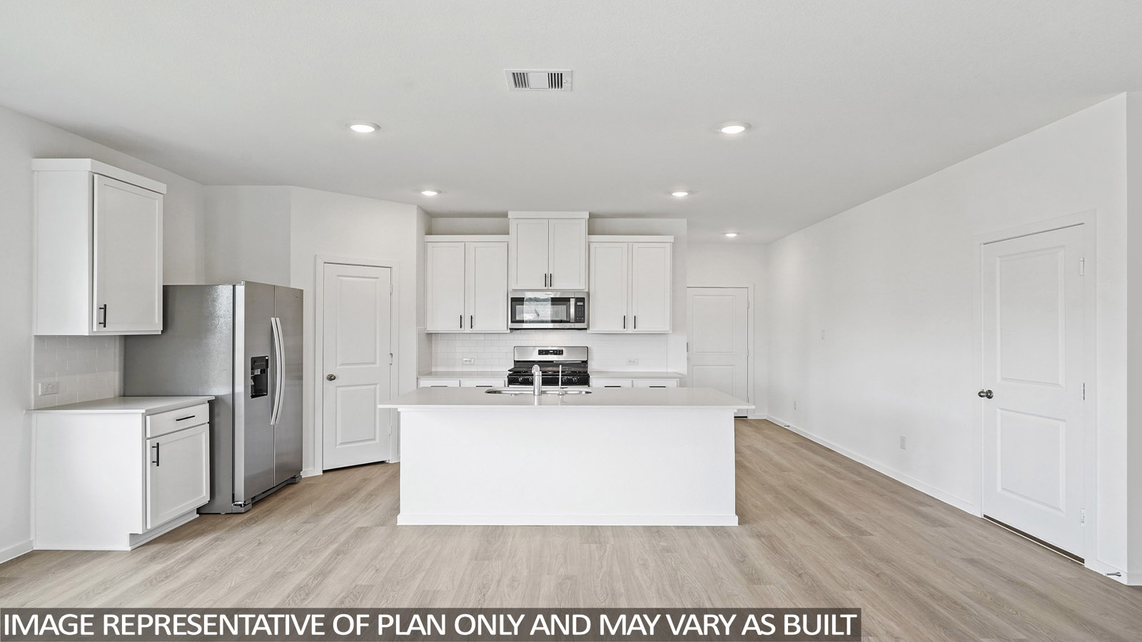 Kitchen with quartz countertops and marden hardware and an island and vinyl floor