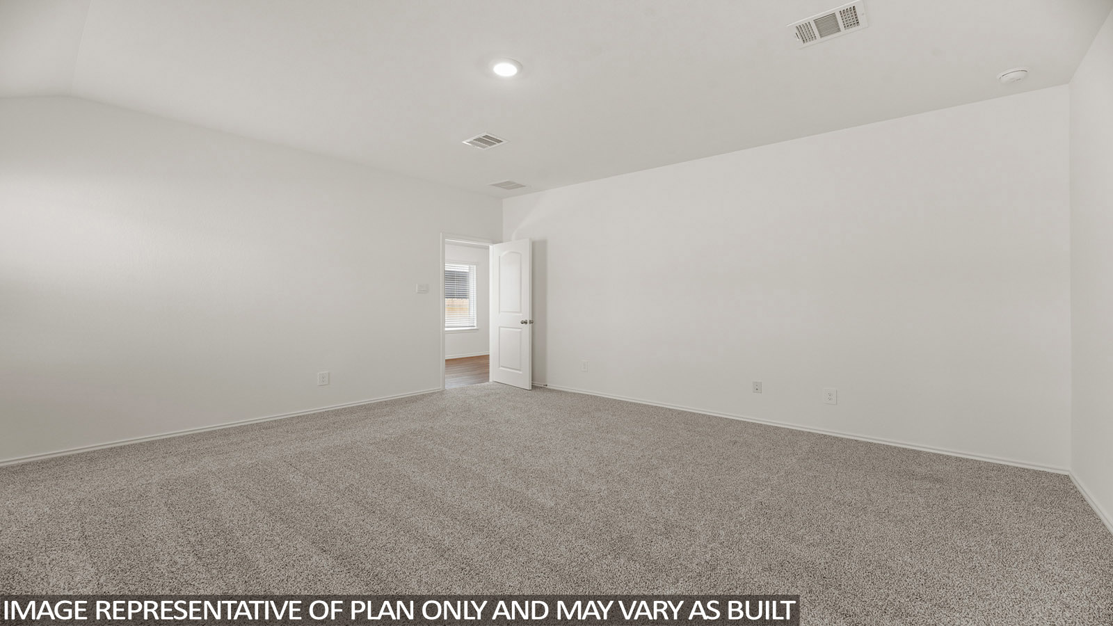 Primary bedroom with carpet flooring