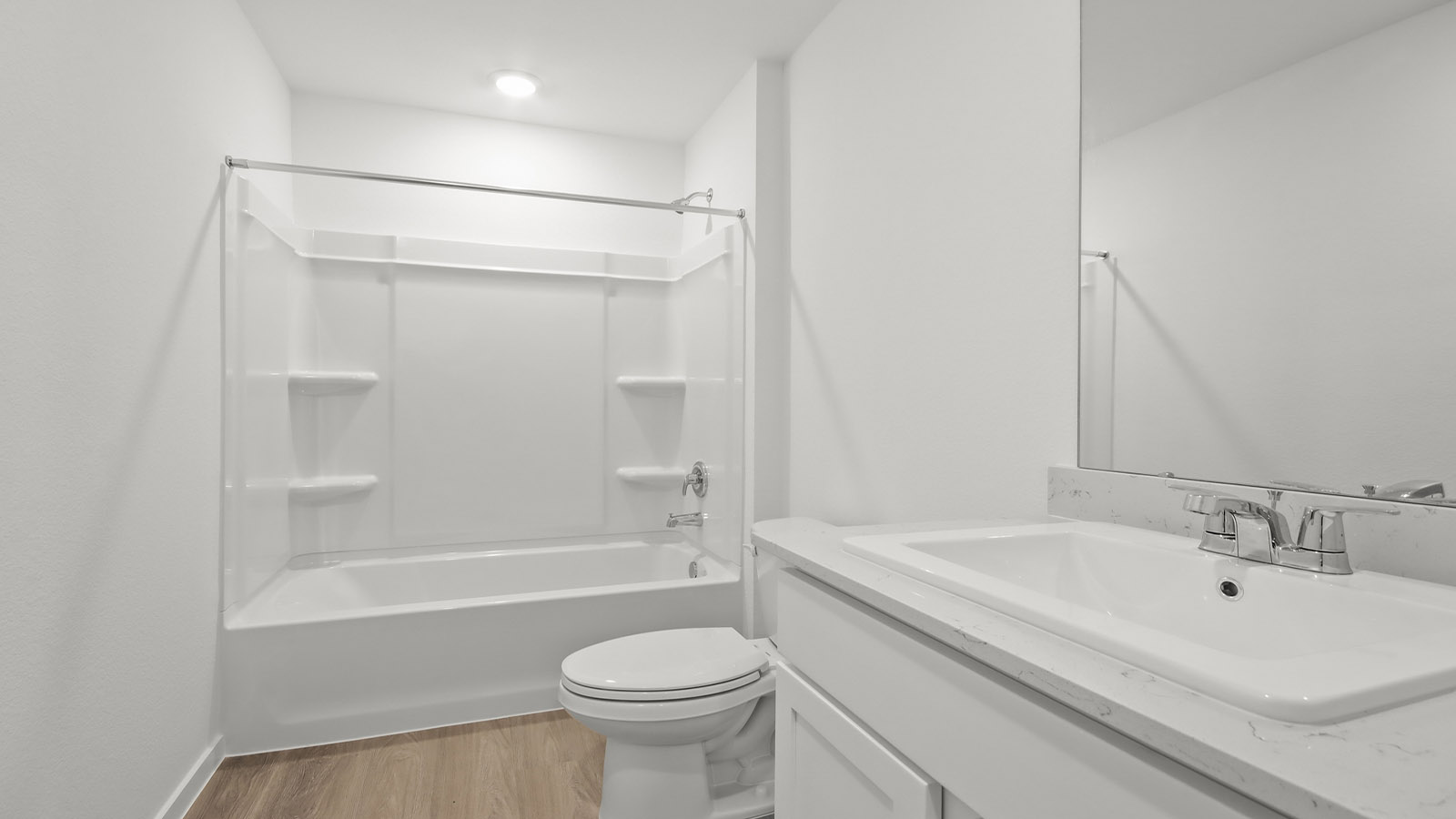 Secondary bathroom with tub/shower combo with quartz counter tops in Magnolia TX