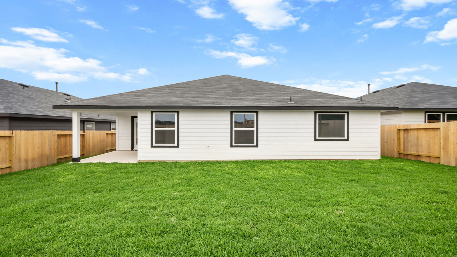 covered patio with jamies hardie siding and overhead lighting