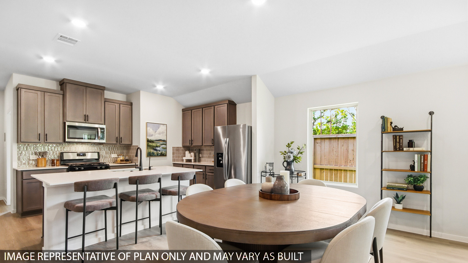 Kitchen with quartz countertops and marden hardware and an island and vinyl floor