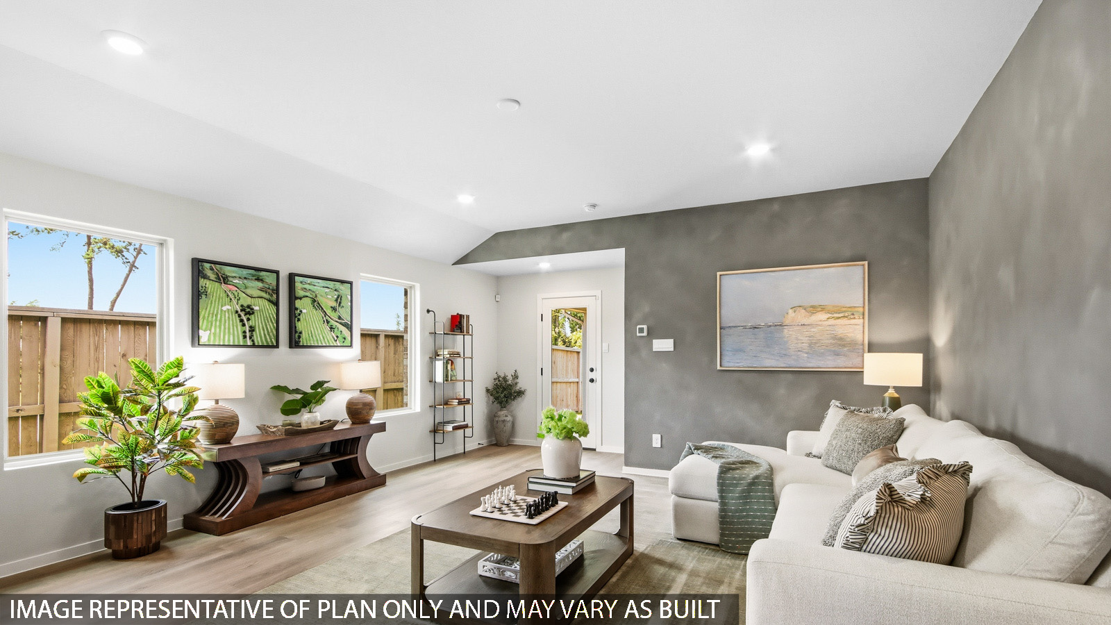 Spacious living area with vinyl flooring and bright windows in Magnolia TX