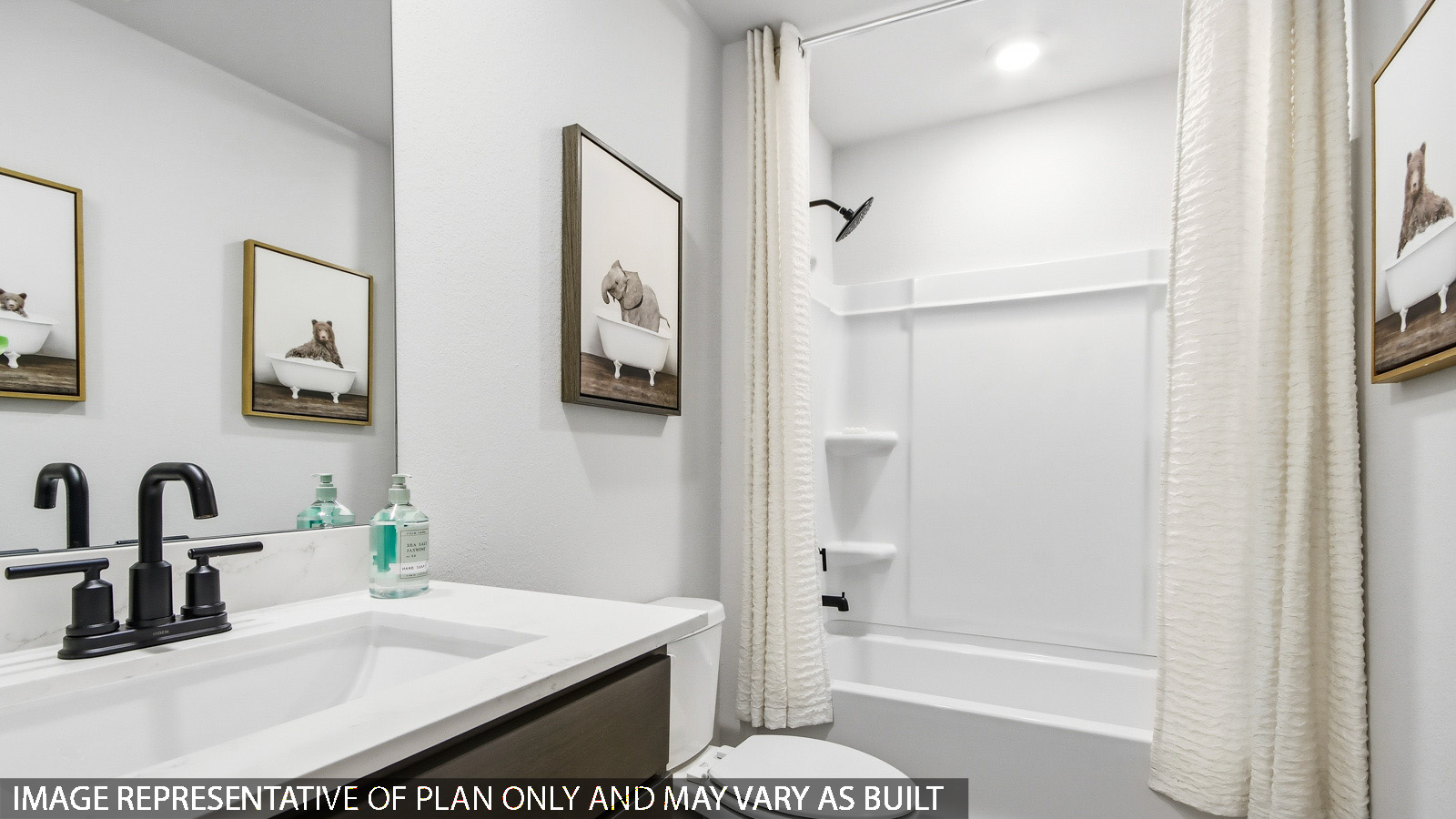 Secondary bathroom with tub/shower combo with quartz counter tops in Magnolia TX