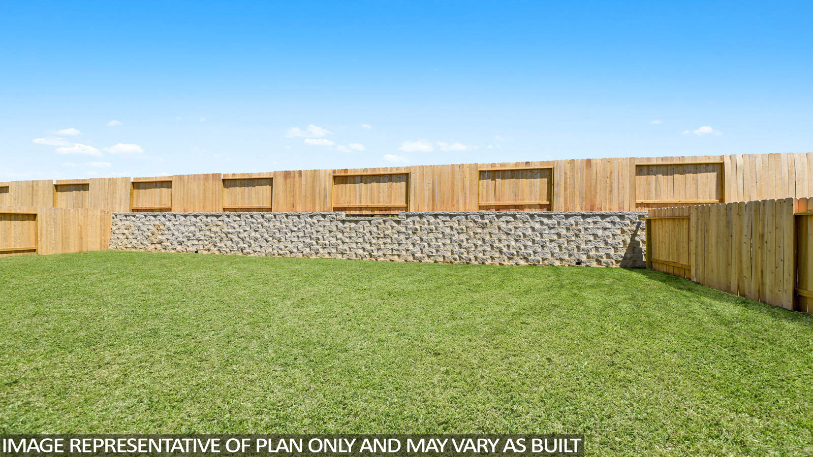 Landscaped backyard with a covered patio.