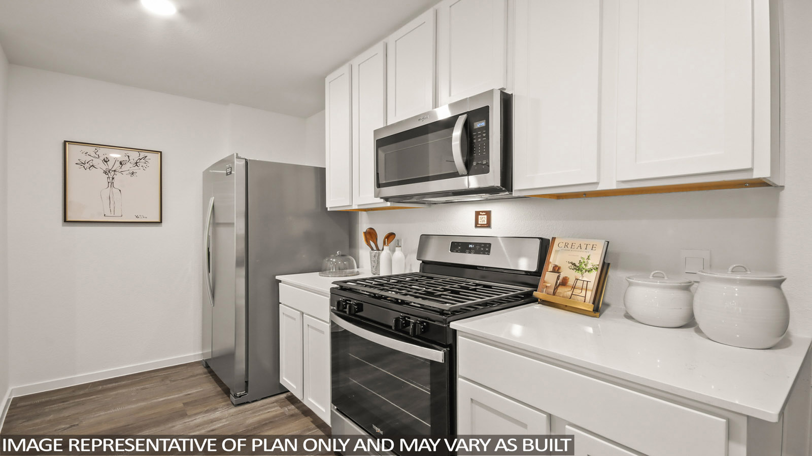 Open concept living, dining, and kitchen area with vinyl flooring and bright windows
