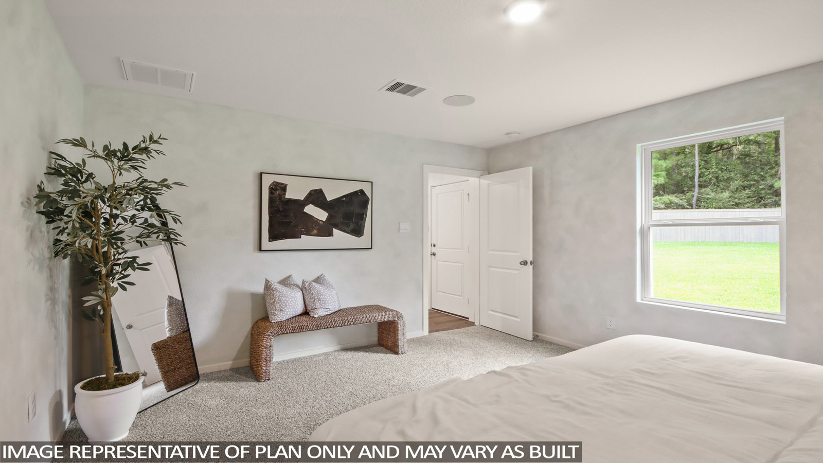Large Primary bedroom with shag carpet flooring and bright window