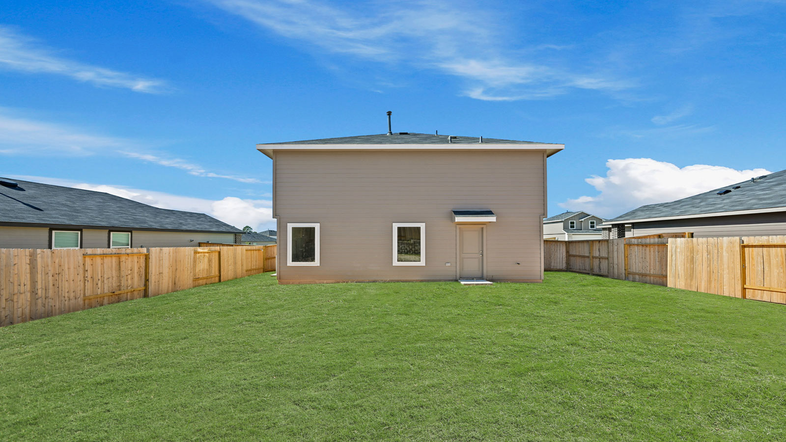 two story home with siding and stone