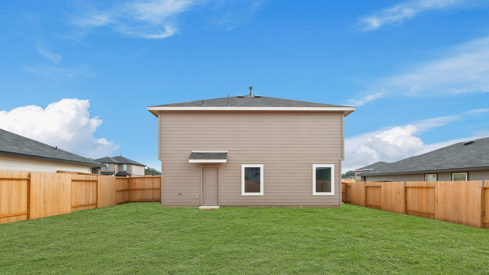 two story home with siding and stone