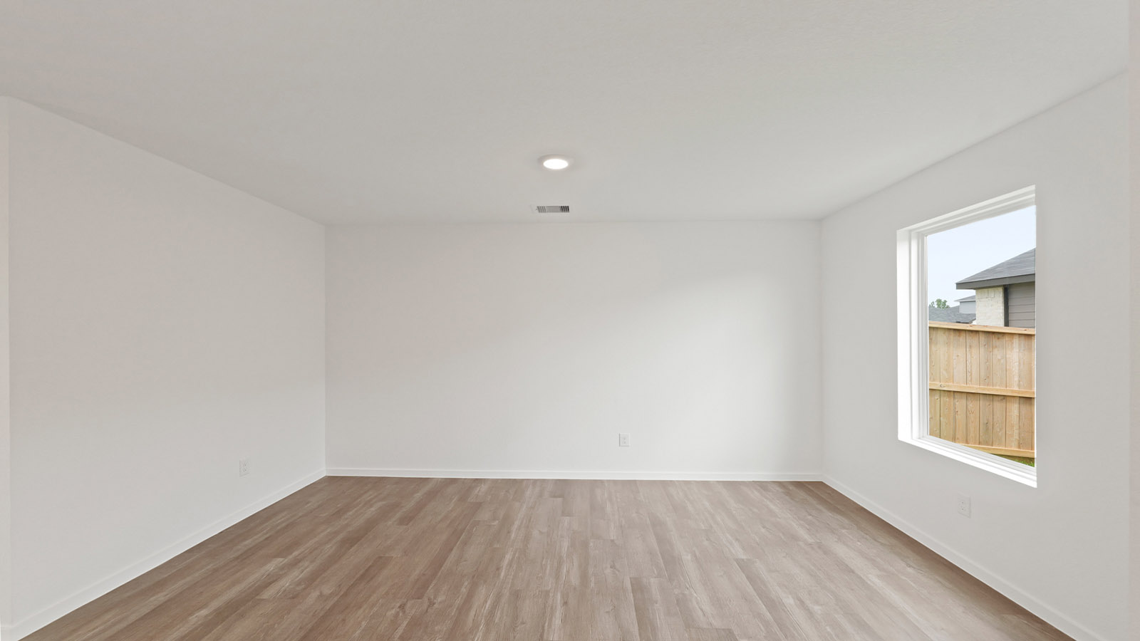 bright and open living room with vinyl floor