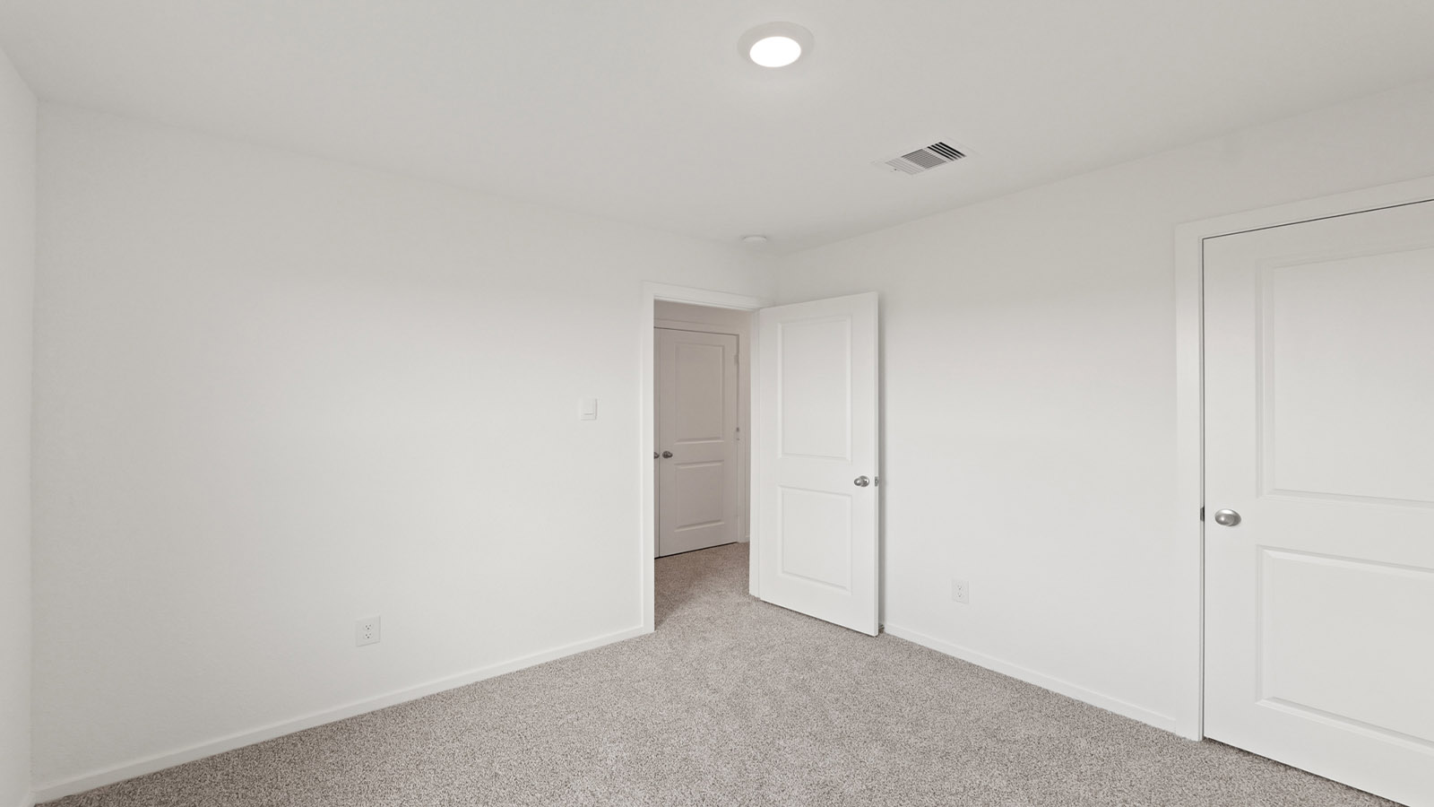 bedroom with window and carpet