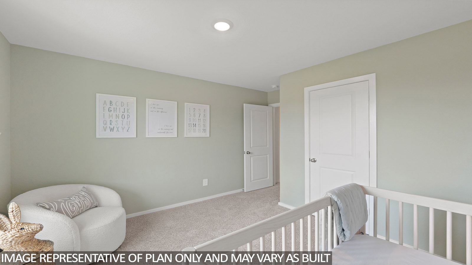 Secondary bedroom with carpet flooring