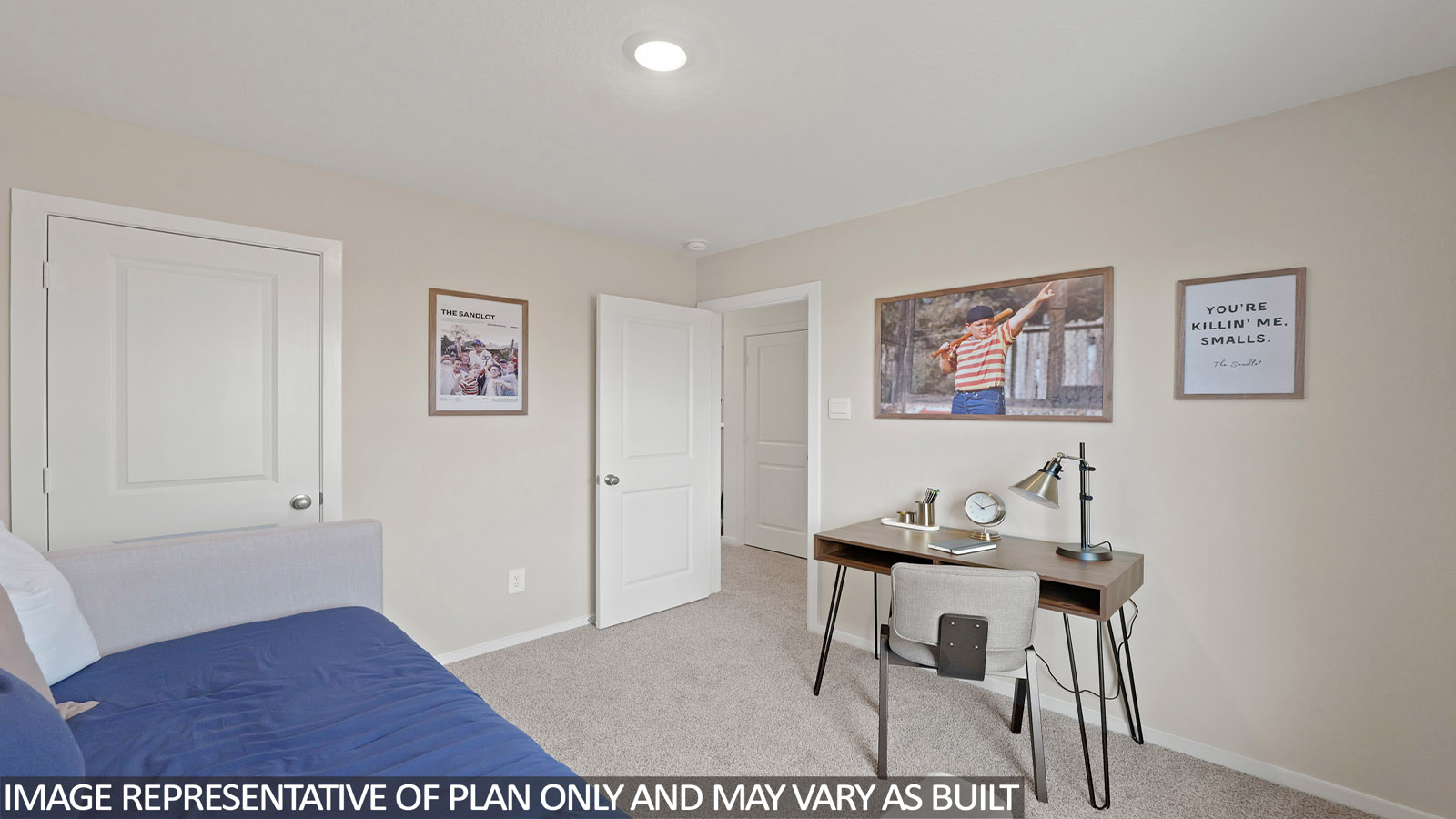 Secondary bedroom with carpet flooring