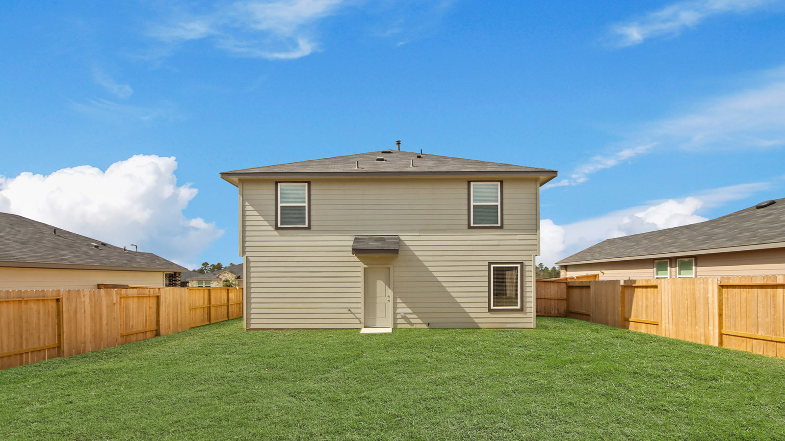 two story home with siding and stone