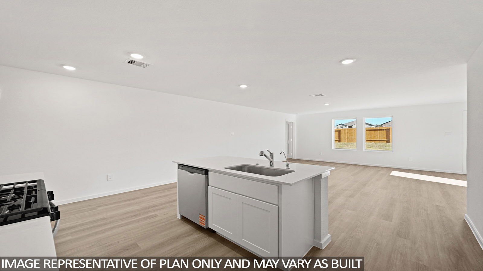 Kitchen with an island and vinyl floor