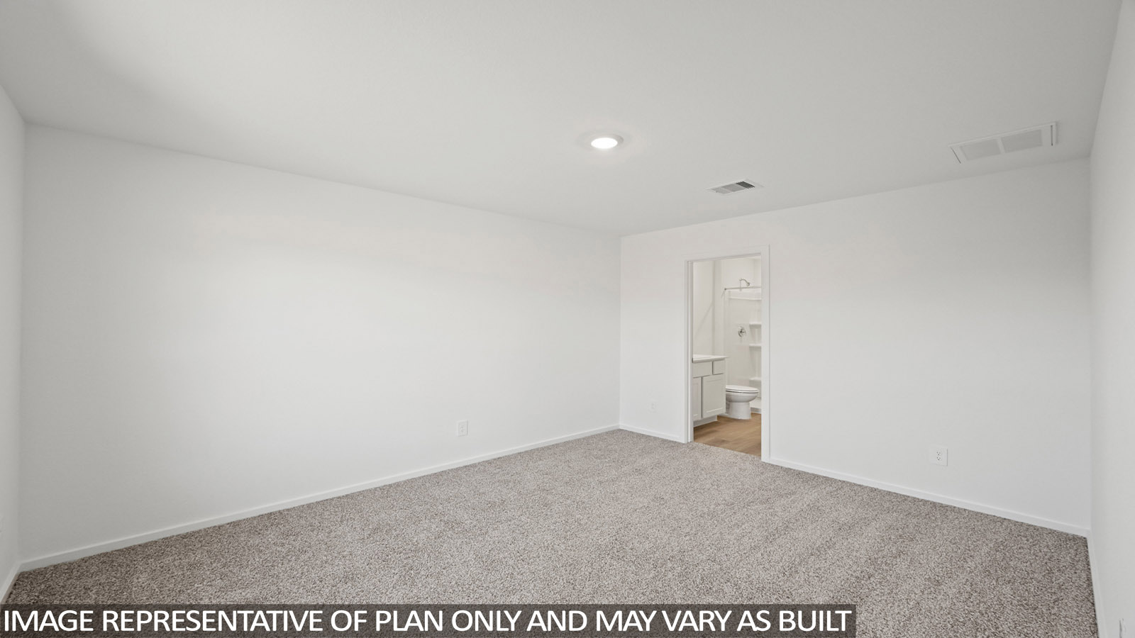Primary bedroom with carpet flooring