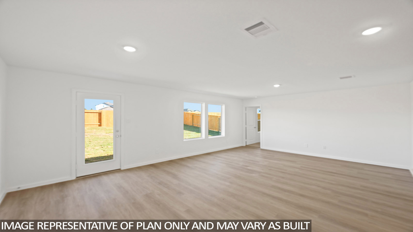 Spacious living area with vinyl flooring and bright windows in Magnolia TX