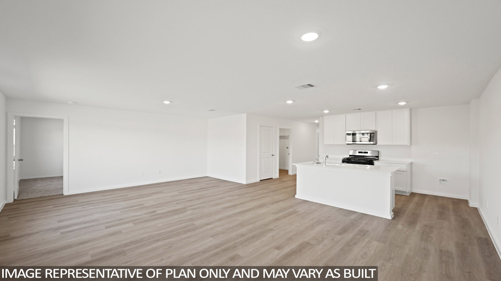 Open concept living, dining, and kitchen area with vinyl flooring and bright windows