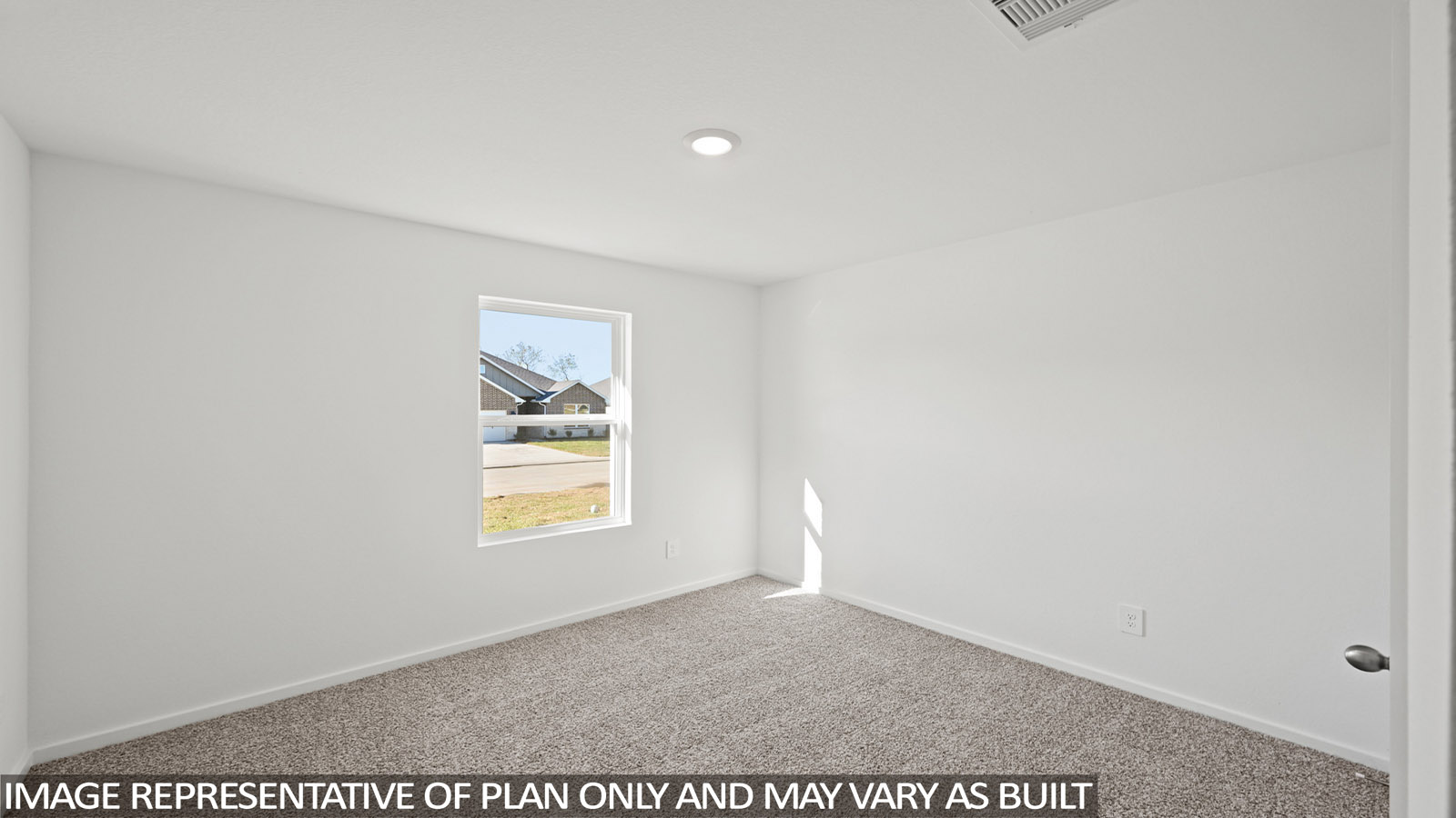 Secondary bedroom with shag carpet flooring and bright window