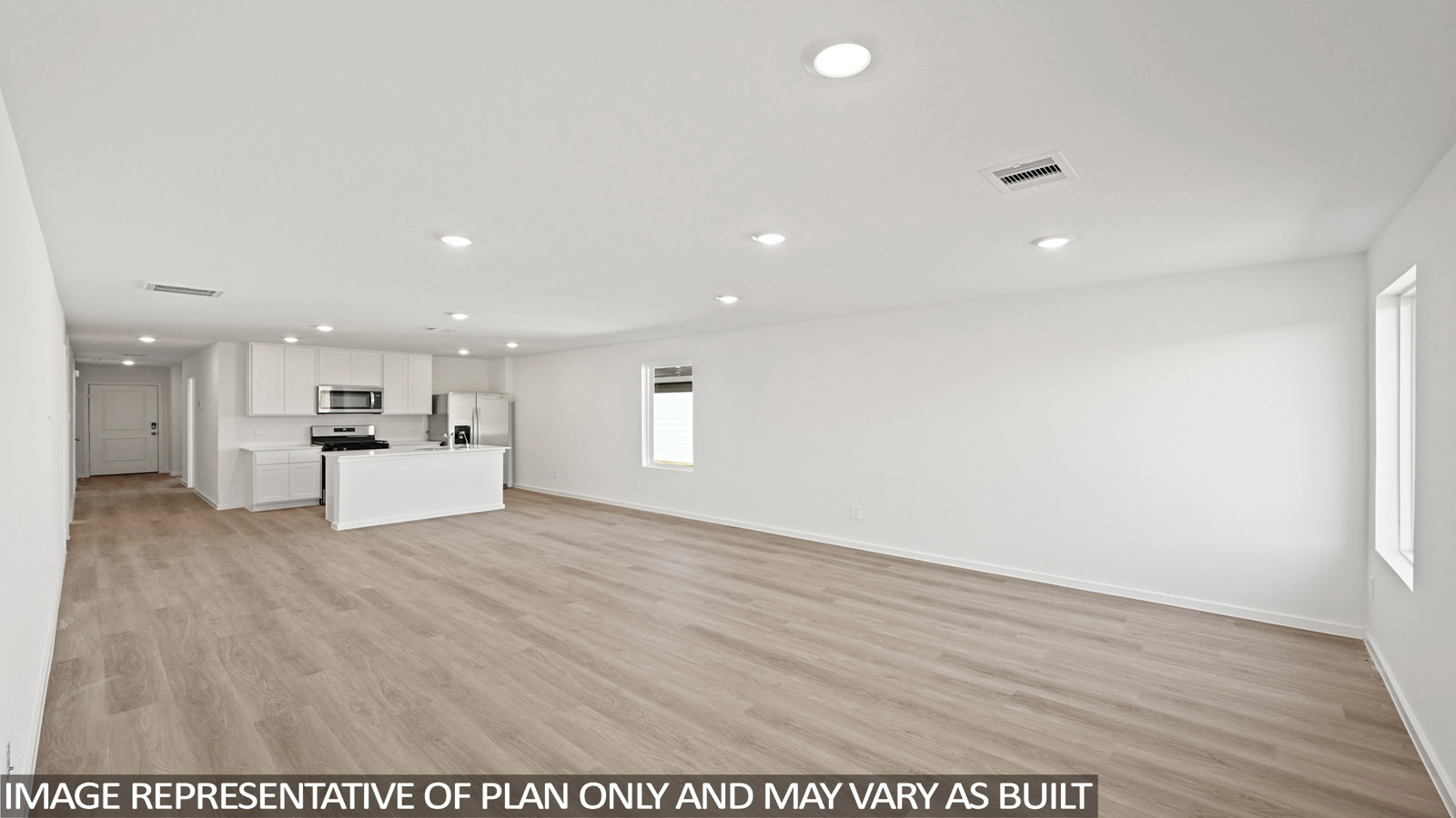 Spacious living area with vinyl flooring