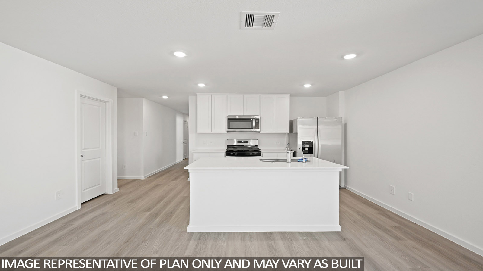 Kitchen with an island and vinyl floor