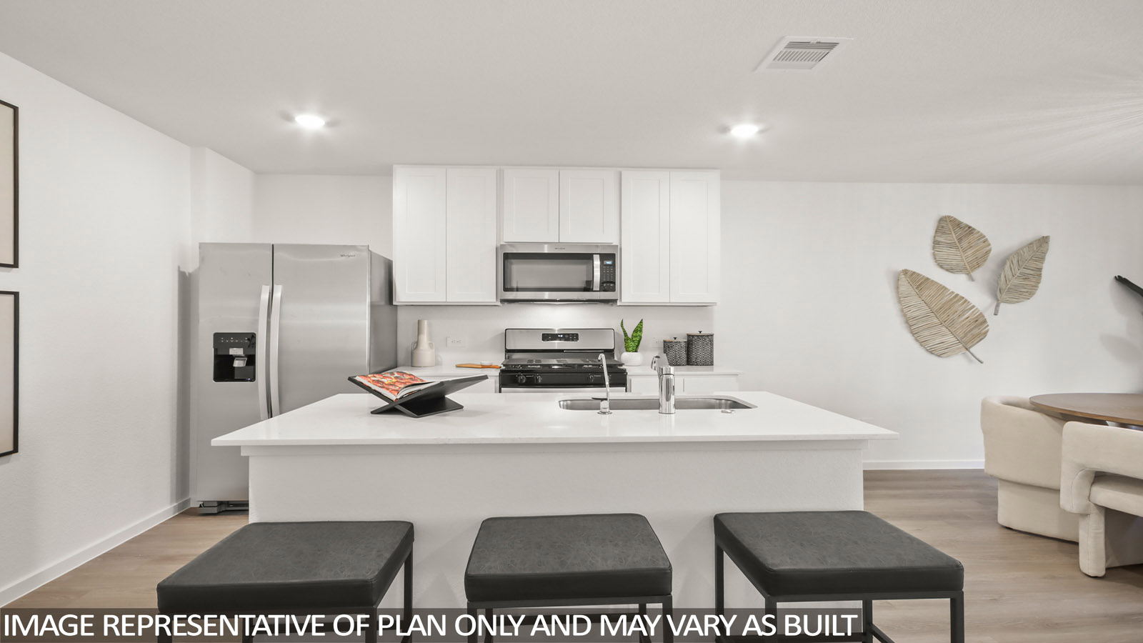 Kitchen with an island and vinyl floor