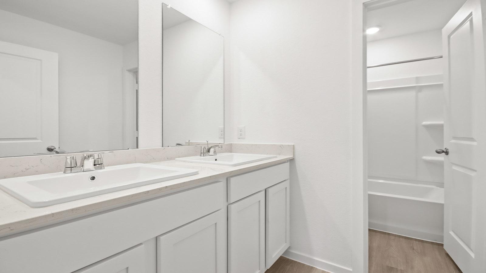 Secondary bathroom with tub/shower combo with quartz counter tops in Magnolia TX