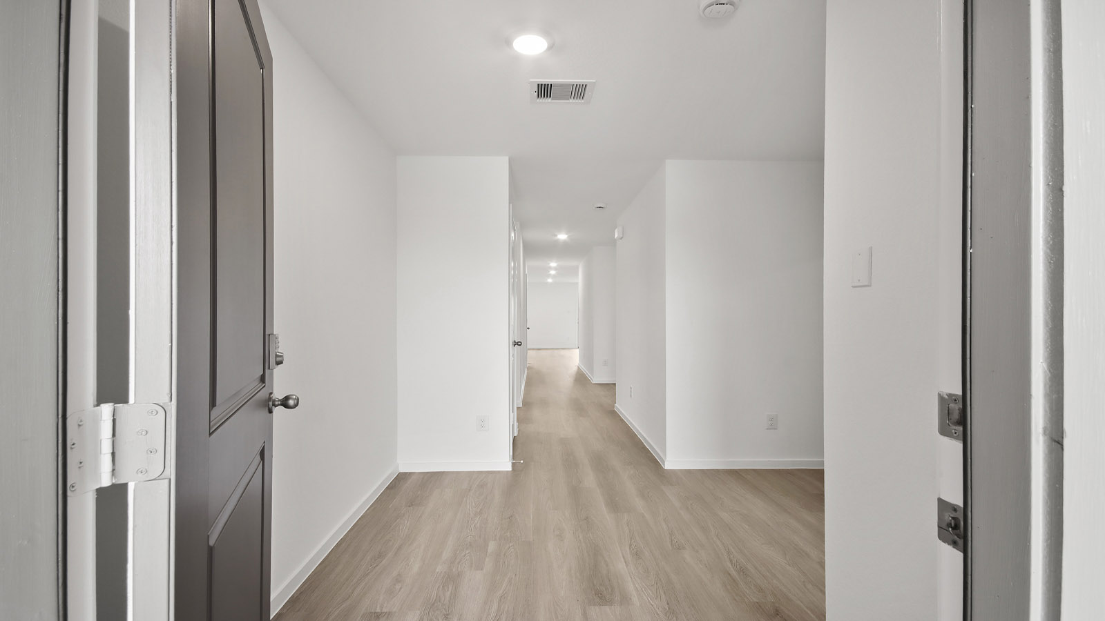 Entry hallway with vinyl flooring sherman williams painted walls