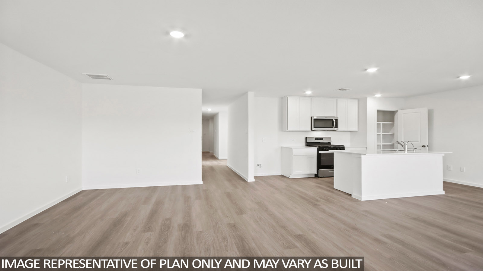 Spacious living area with vinyl flooring and bright windows in Magnolia TX